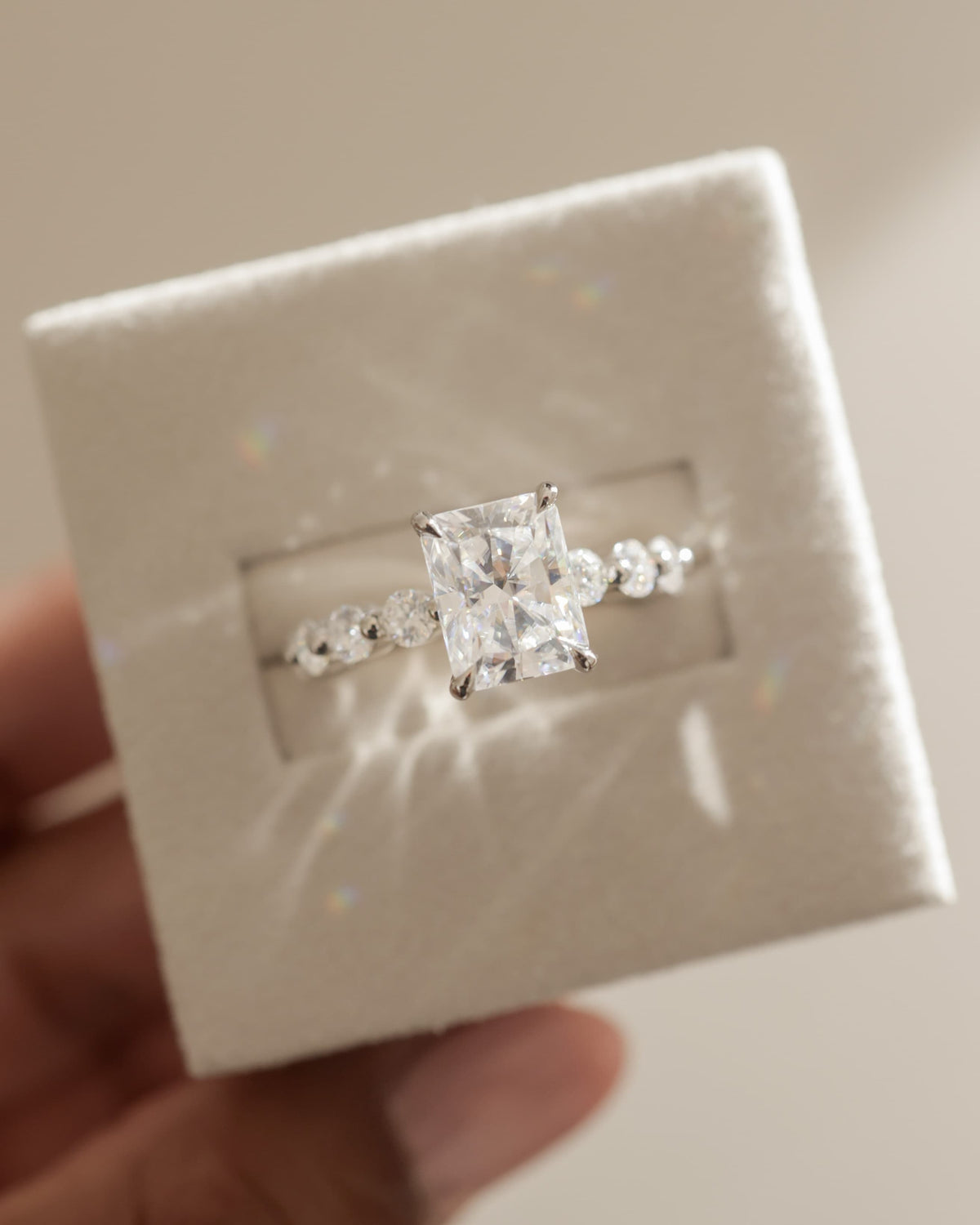 Josephine - Radiant Claw Solitaire with Round Accent Stones and Wrap Around Hidden Halo Engagement Ring - Yellow Gold