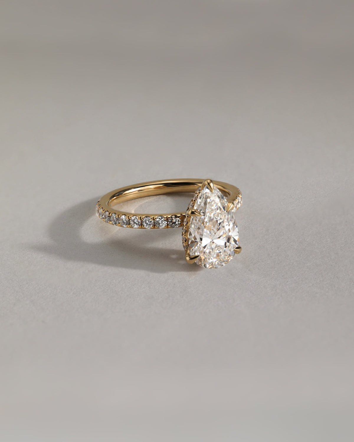 Jordanna - Pear Claw Solitaire with Wrap Around Hidden Halo and Pave Band Engagement Ring - Yellow Gold