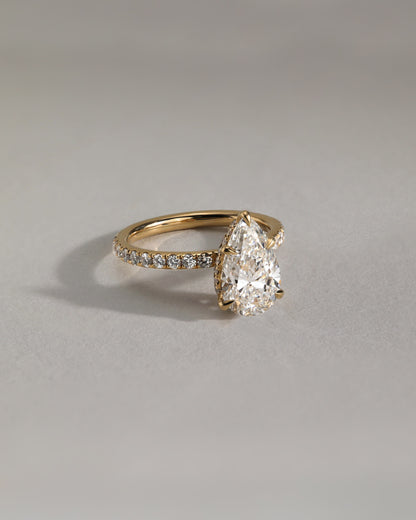 Jordanna - Pear Claw Solitaire with Wrap Around Hidden Halo and Pave Band Engagement Ring - Yellow Gold