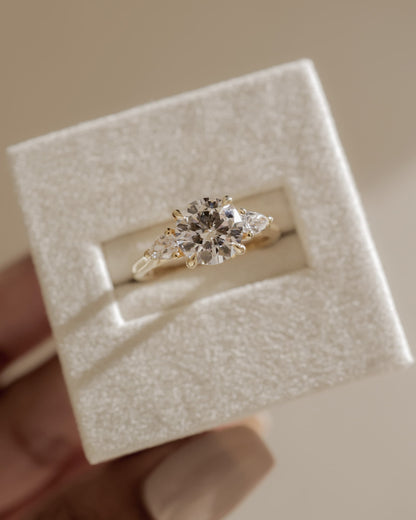 Arya - Round Claw Trilogy with Pear Side Stones and Cathedral Setting Engagement Ring - White Gold
