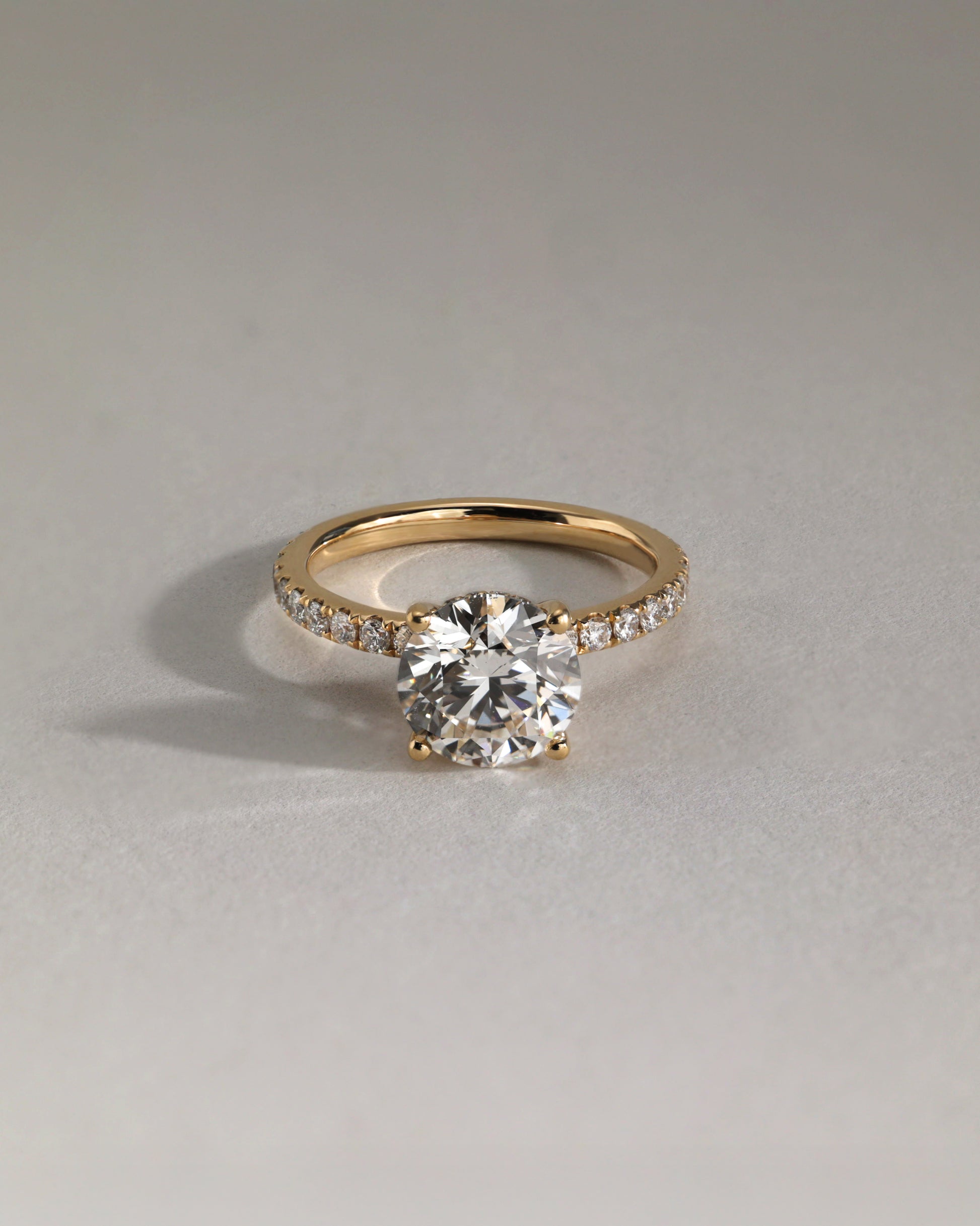 Charlie - Round Claw Solitaire with Hidden Halo and Pave Band Engagement Ring - Rose Two-Tone - Lifestyle