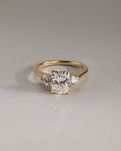 Charmaine - Elongated Cushion Claw Trilogy with Round Side Stones and Lily Detail Engagement Ring - Platinum
