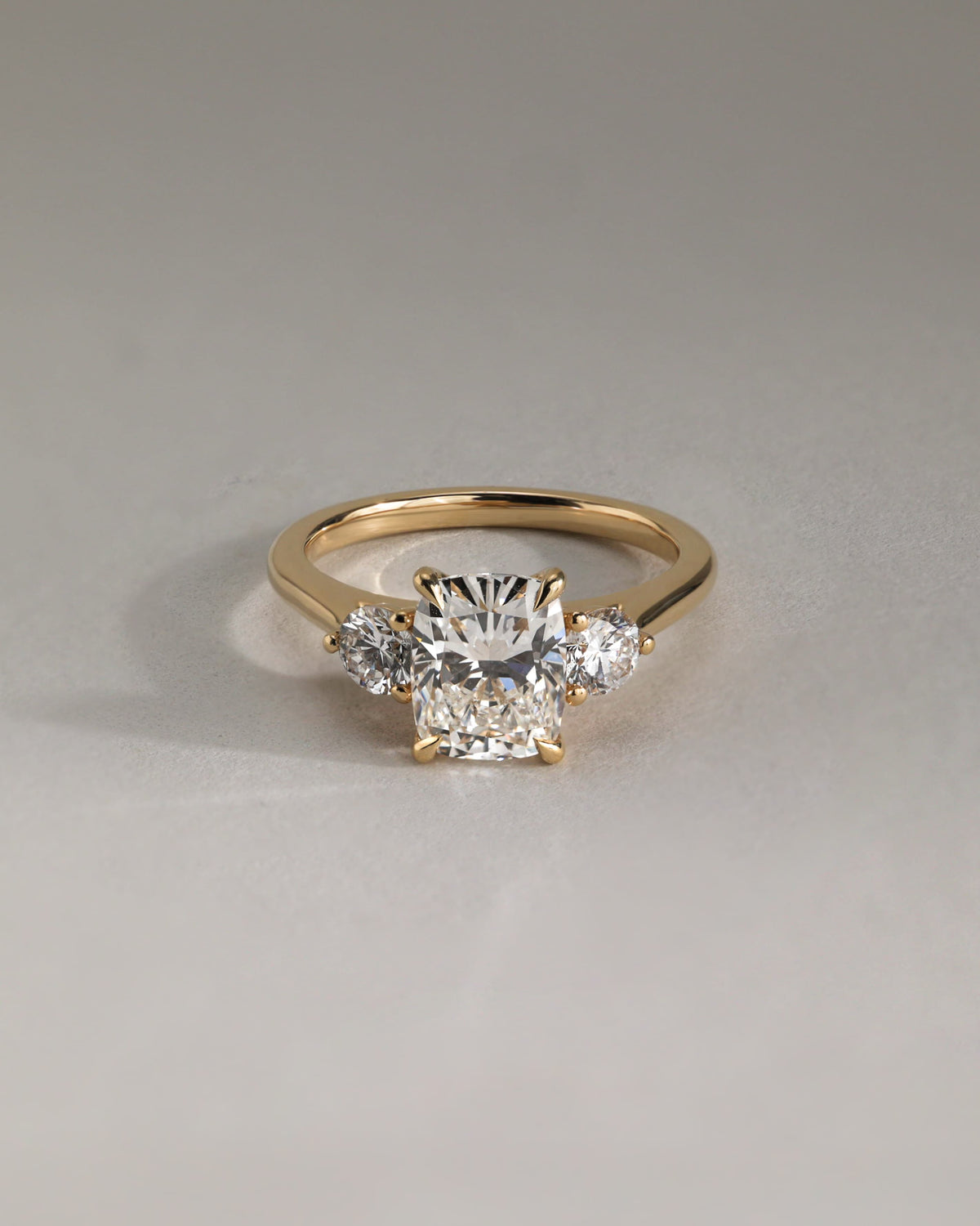 Charmaine - Elongated Cushion Claw Trilogy with Round Side Stones and Lily Detail Engagement Ring - White Gold