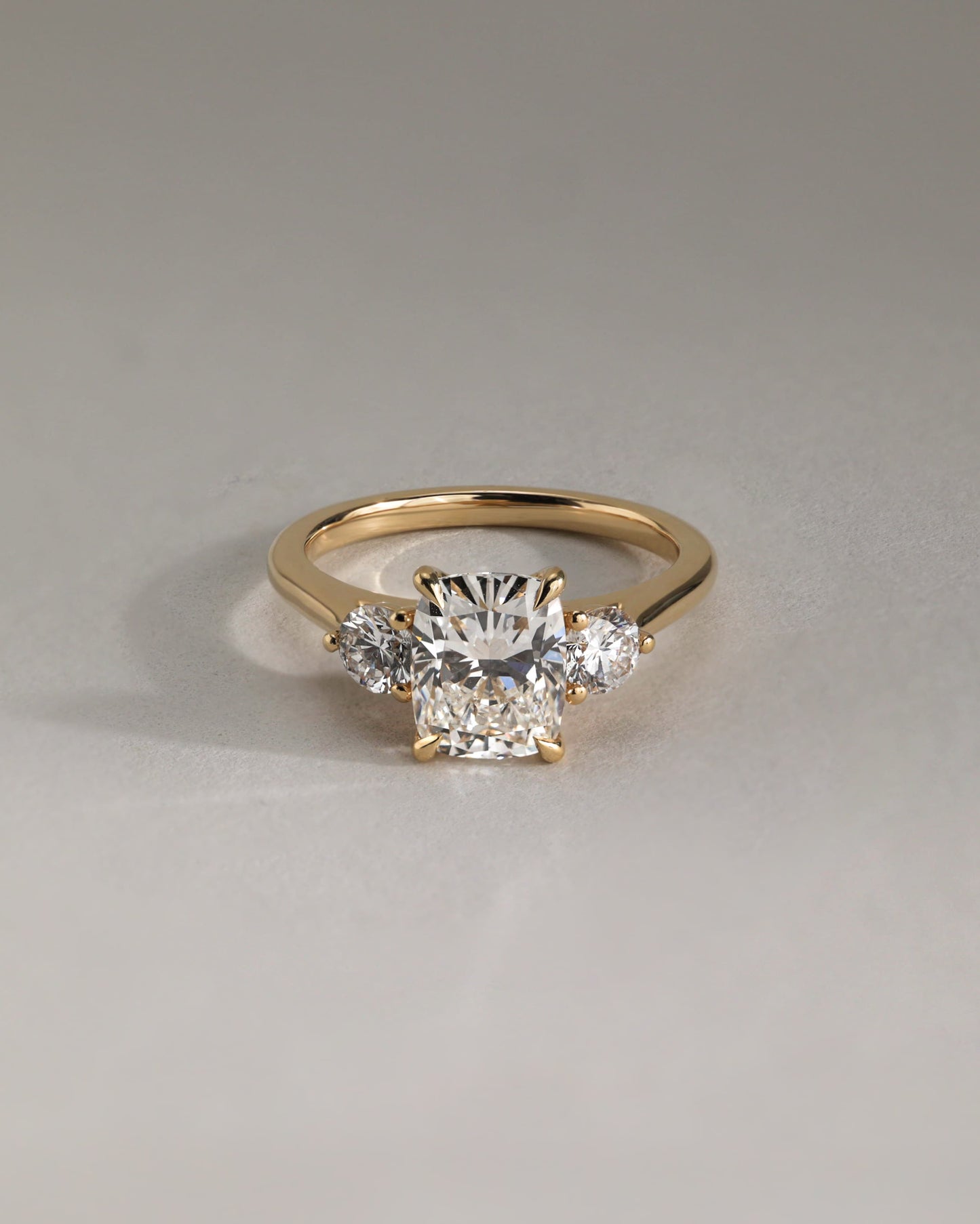 Charmaine - Elongated Cushion Claw Trilogy with Round Side Stones and Lily Detail Engagement Ring - Yellow Gold