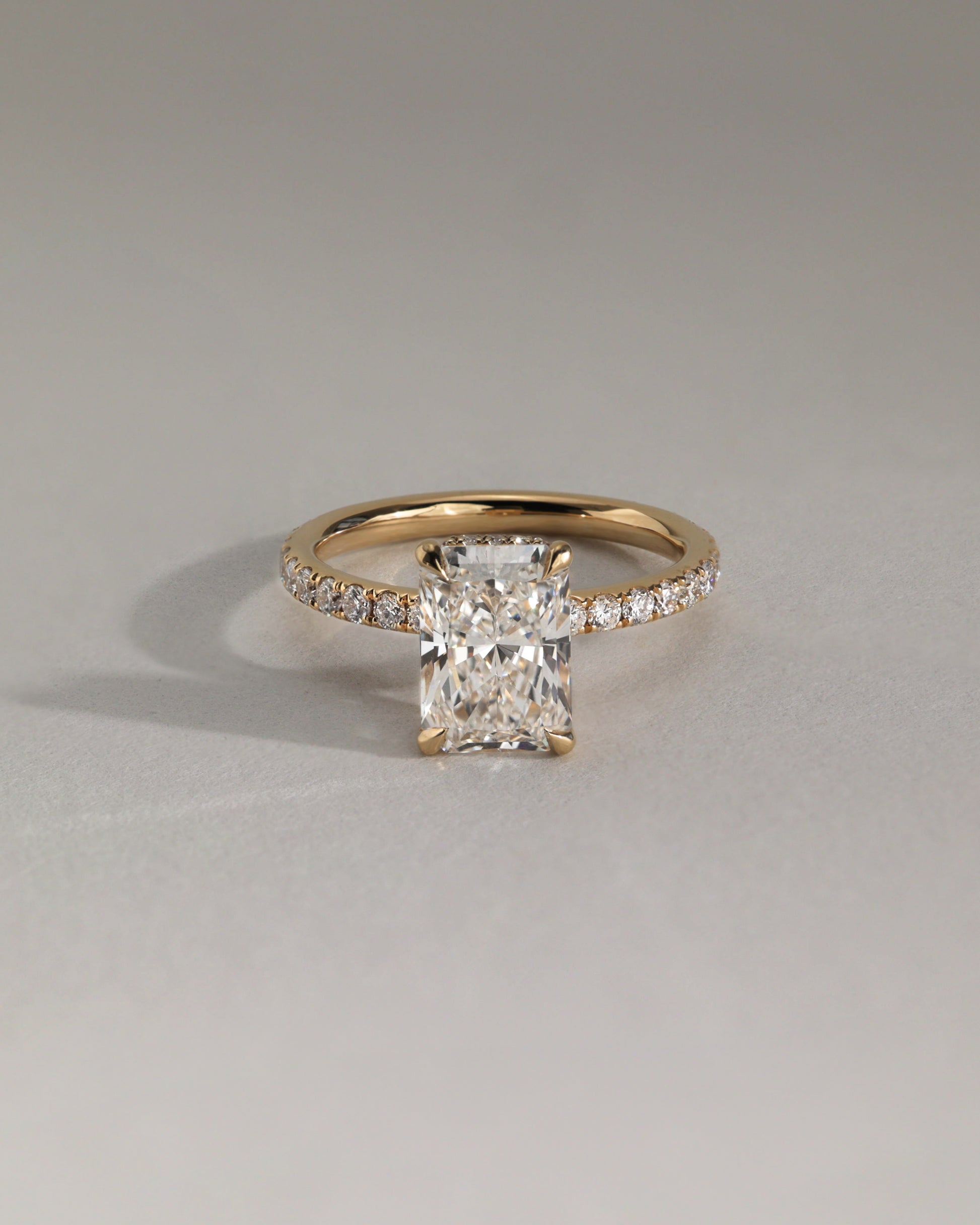 Ellie - Radiant Claw Solitaire with Wrap Around Hidden Halo and Pave Band Engagement Ring - Rose Two-Tone - Lifestyle
