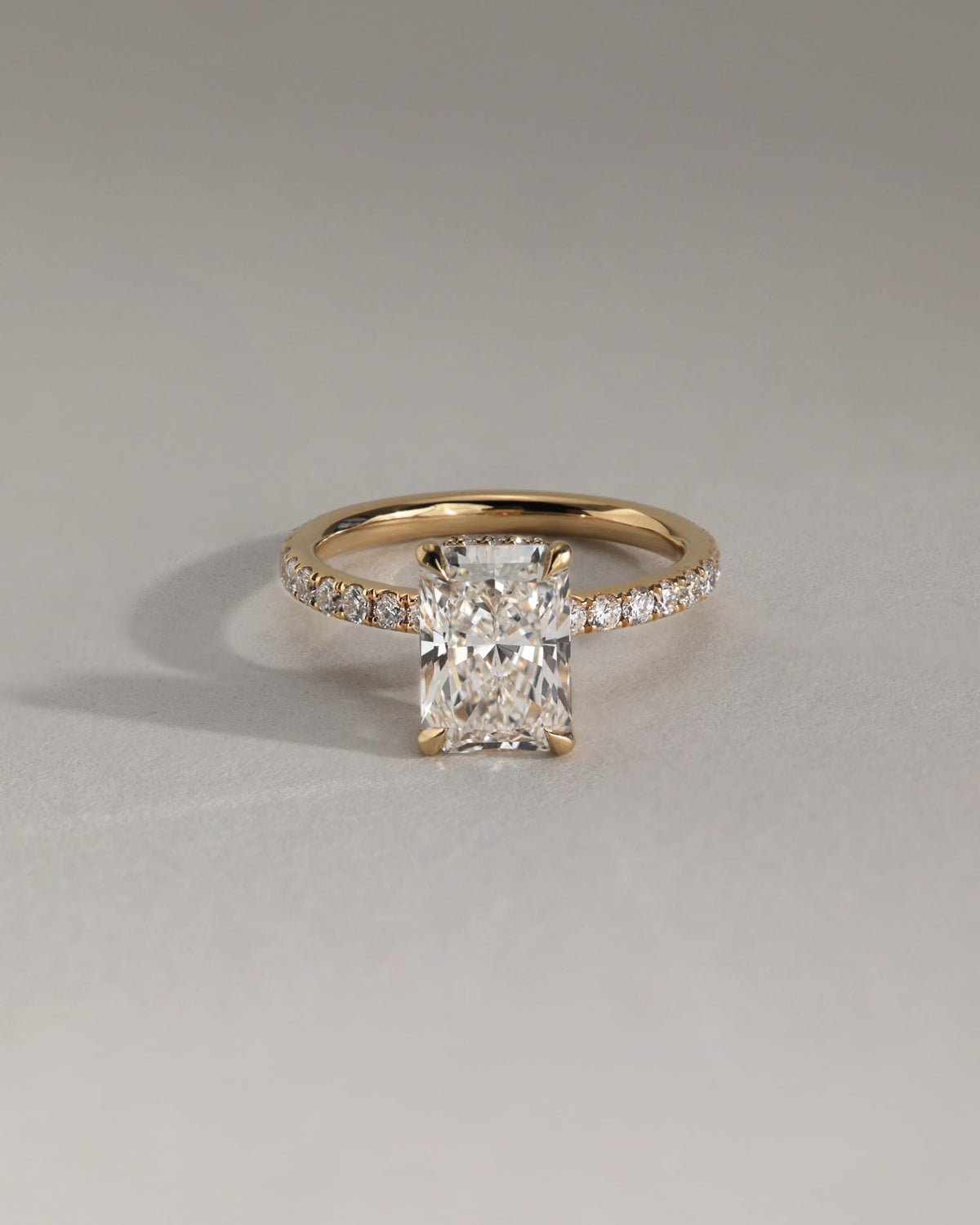 Ellie - Radiant Claw Solitaire with Wrap Around Hidden Halo and Pave Band Engagement Ring - Yellow Gold