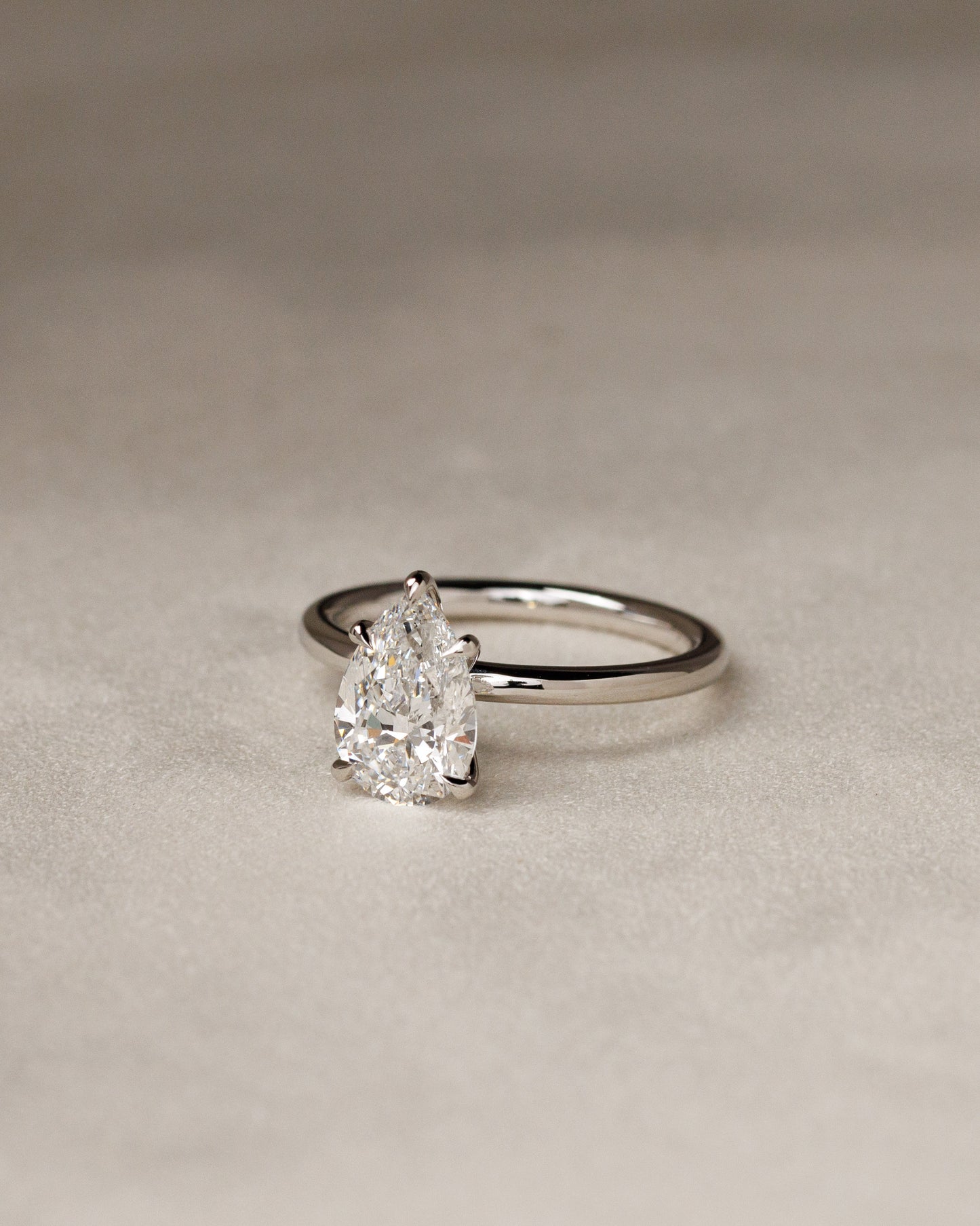 Alia - Pear Claw Solitaire Engagement Ring - Rose Two-Tone - Lifestyle