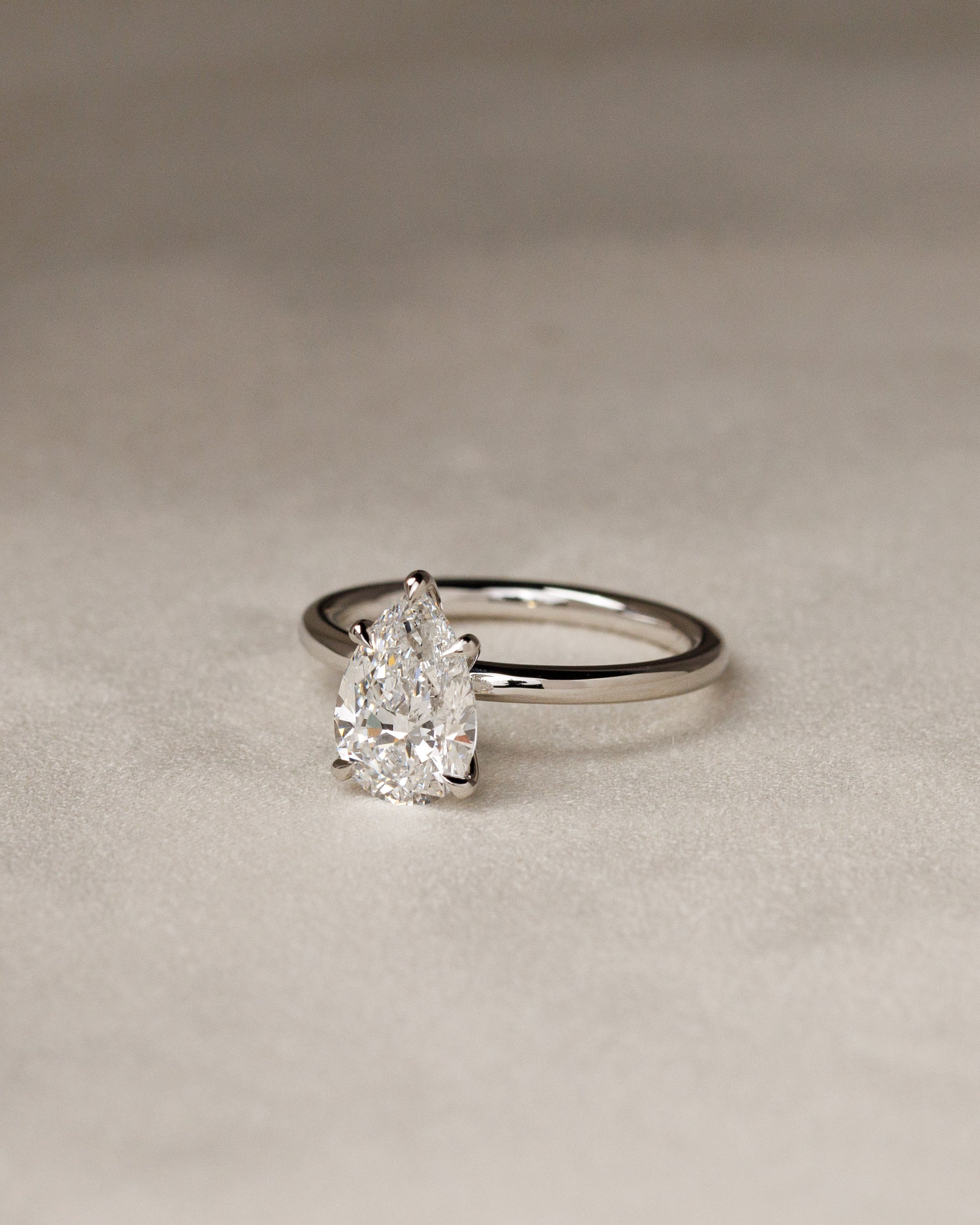 Alia - Pear Claw Solitaire Engagement Ring - Rose Two-Tone - Lifestyle
