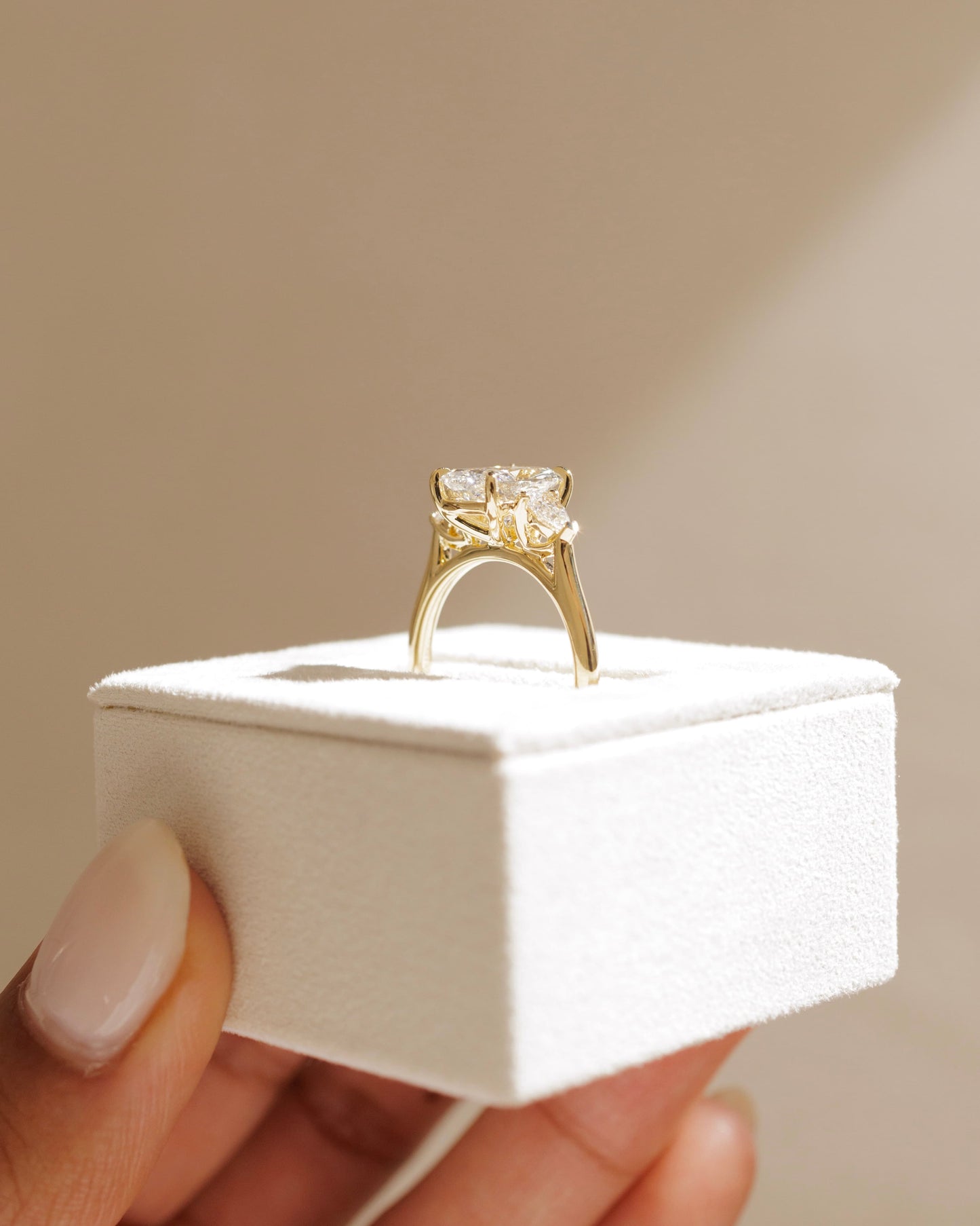 Cataleya - Elongated Cushion Claw Trilogy with Pear Side Stones and Cathedral Setting Engagement Ring - Yellow Gold