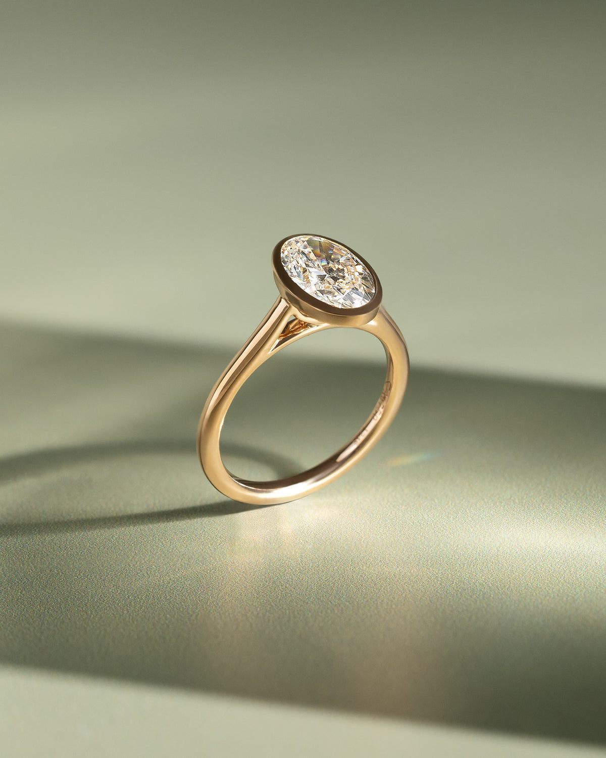 Daphne - Oval Bezel Solitaire with Cathedral High Setting Engagement Ring - Yellow Gold
