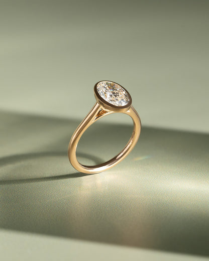 Daphne - Oval Bezel Solitaire with Cathedral High Setting Engagement Ring - Yellow Gold