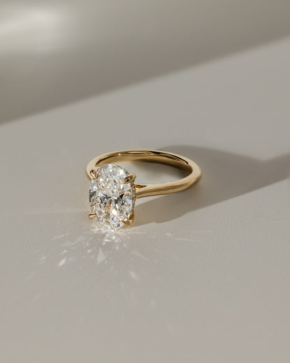 Bethany - Oval Claw Solitaire with Hidden Halo, Tapered Band and Cathedral High Setting Engagement Ring - Platinum