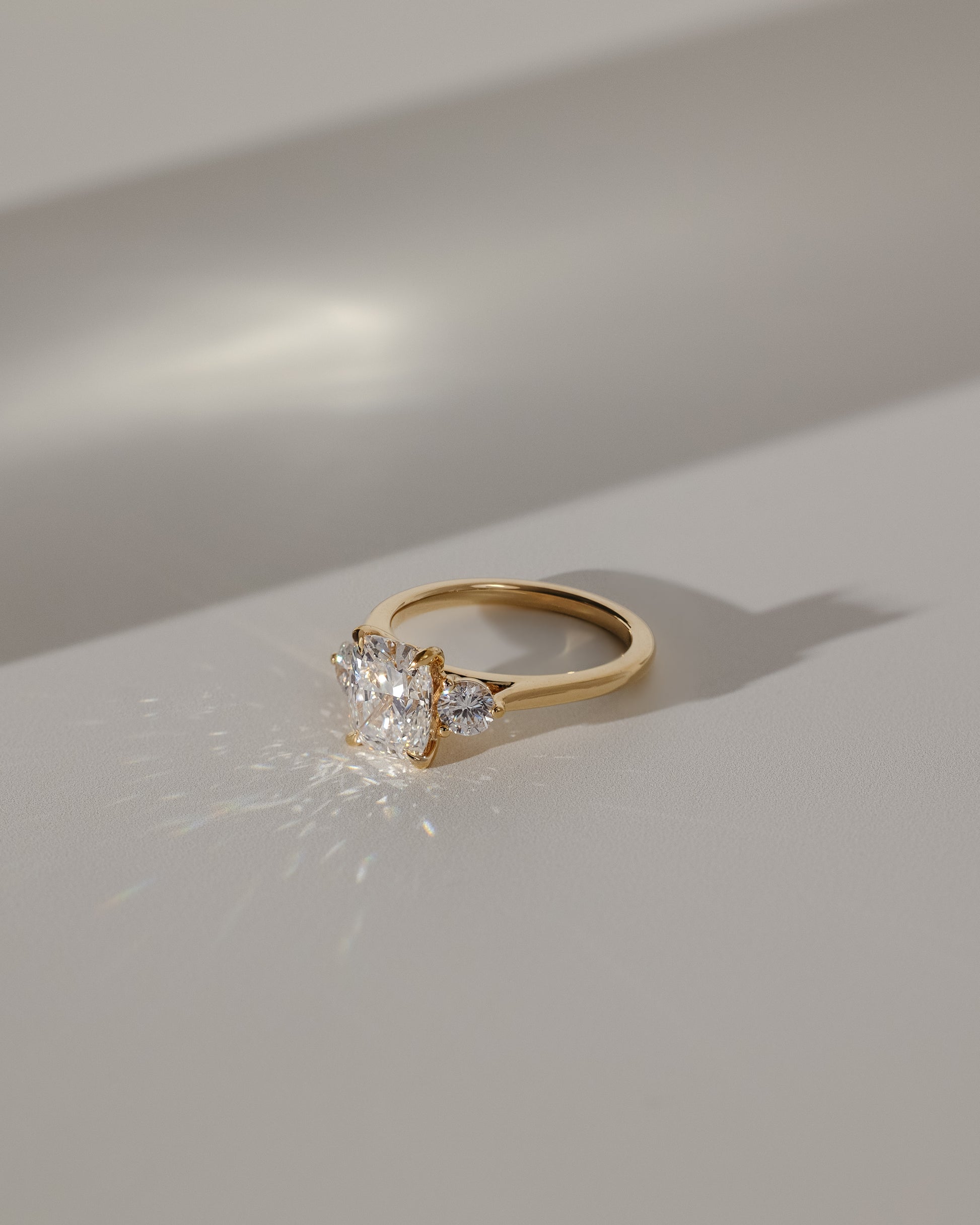Charmaine - Elongated Cushion Claw Trilogy with Round Side Stones and Lily Detail Engagement Ring - Rose Two-Tone - Lifestyle