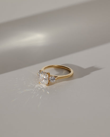 Charmaine - Elongated Cushion Claw Trilogy with Round Side Stones and Lily Detail Engagement Ring - Platinum