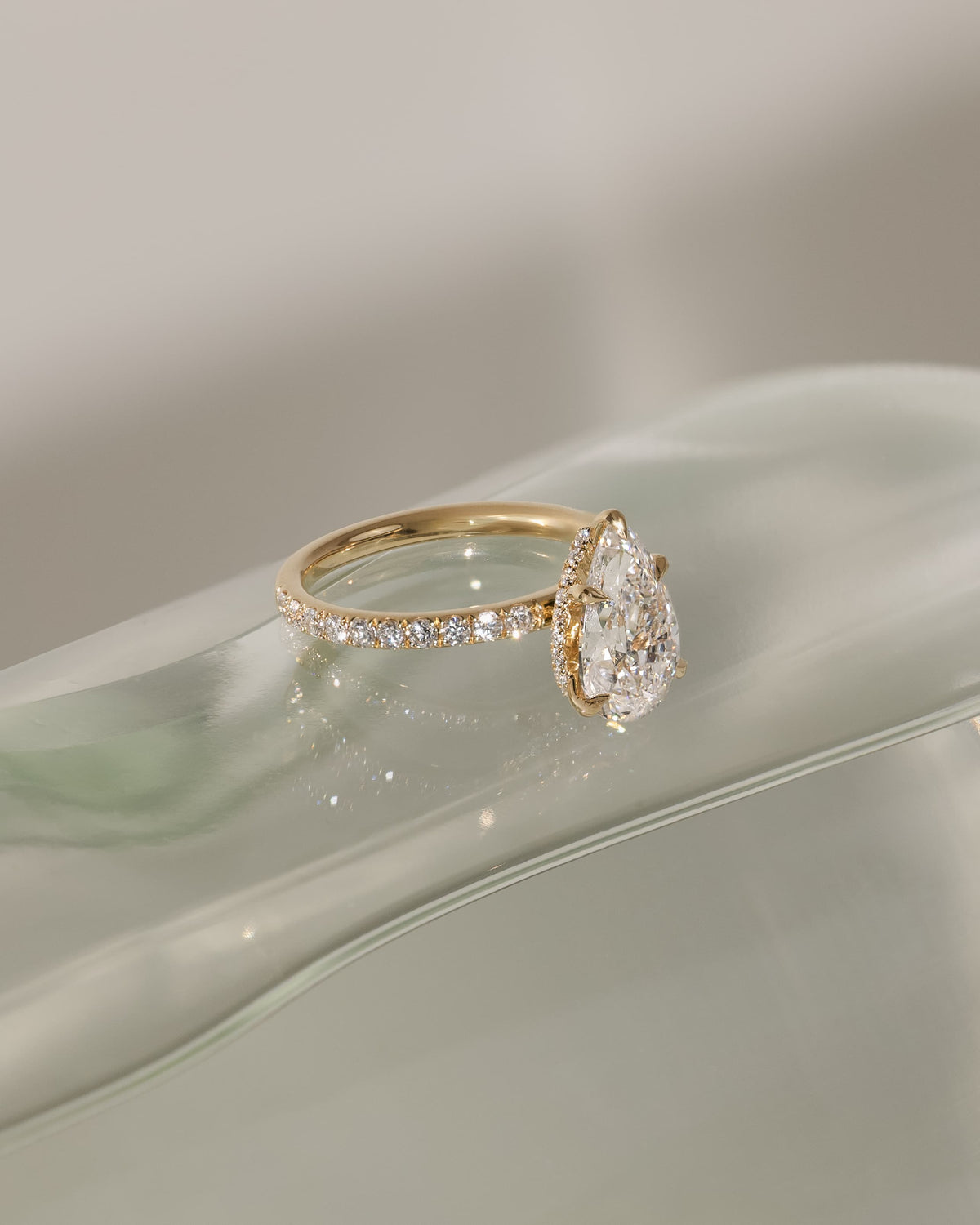Jordanna - Pear Claw Solitaire with Wrap Around Hidden Halo and Pave Band Engagement Ring - Yellow Gold