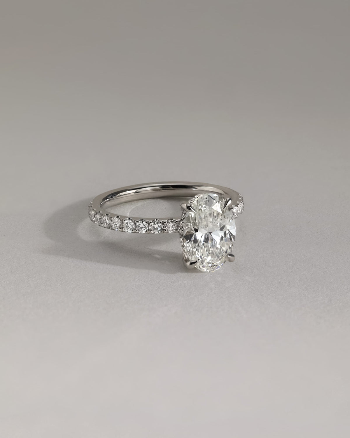 Paige - Oval Claw Solitaire with Hidden Halo and Pave Band Engagement Ring - White Gold
