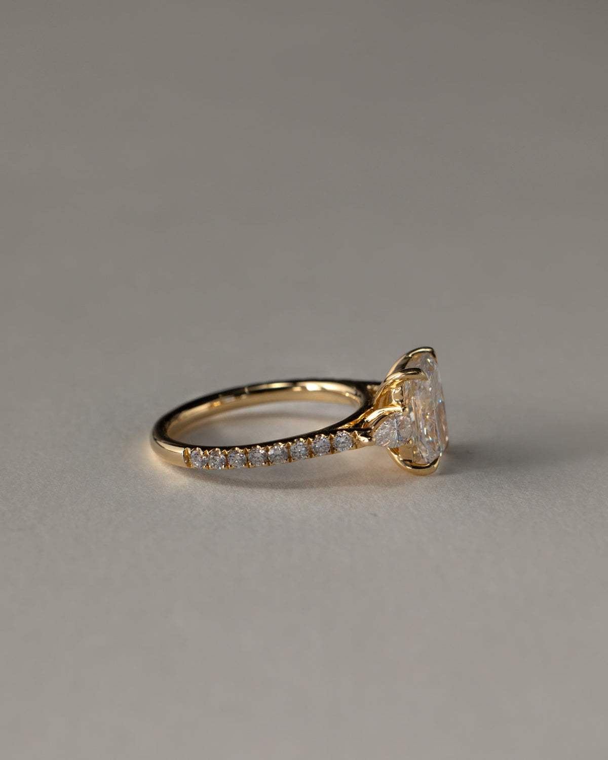 Bree - Elongated Cushion Claw Trilogy with Pear Side Stones and Pave Band Engagement Ring - White Gold