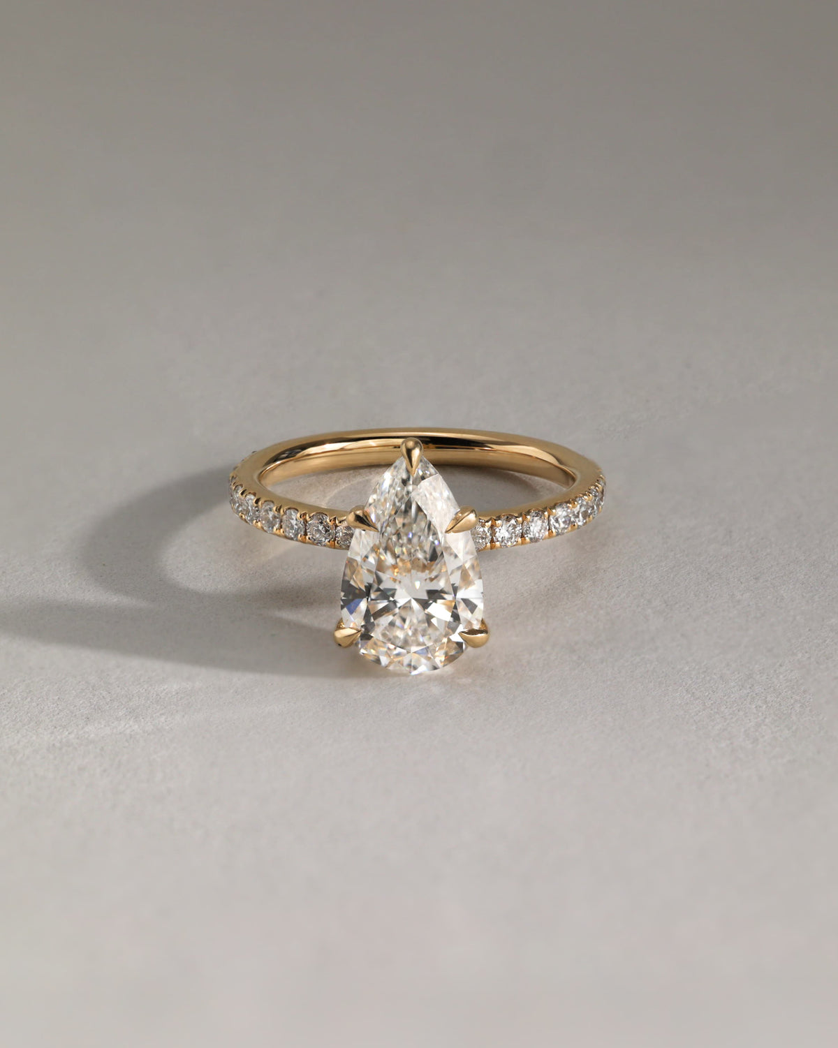 Jordanna - Pear Claw Solitaire with Wrap Around Hidden Halo and Pave Band Engagement Ring - Yellow Gold