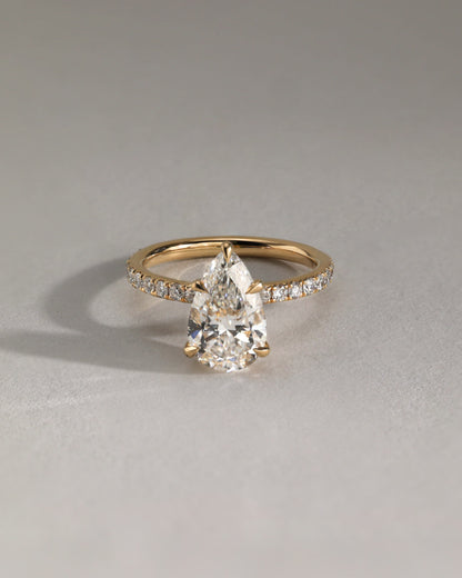 Jordanna - Pear Claw Solitaire with Wrap Around Hidden Halo and Pave Band Engagement Ring - Yellow Gold