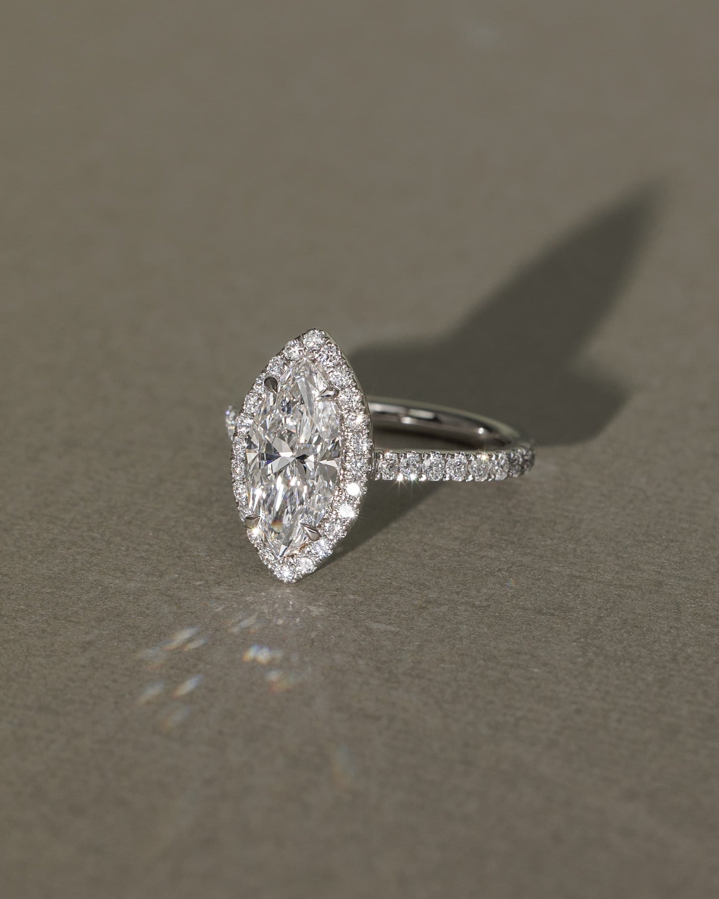 Stefania - Marquise Claw Solitaire with Halo and Pave Band and Cathedral High Setting Engagement Ring - Platinum