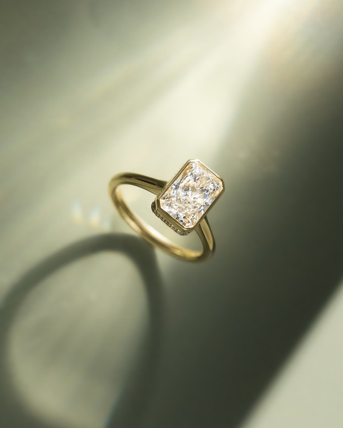 Bennie - Radiant Bezel Solitaire with Hidden Halo and Cathedral High Setting Engagement Ring - Yellow Gold