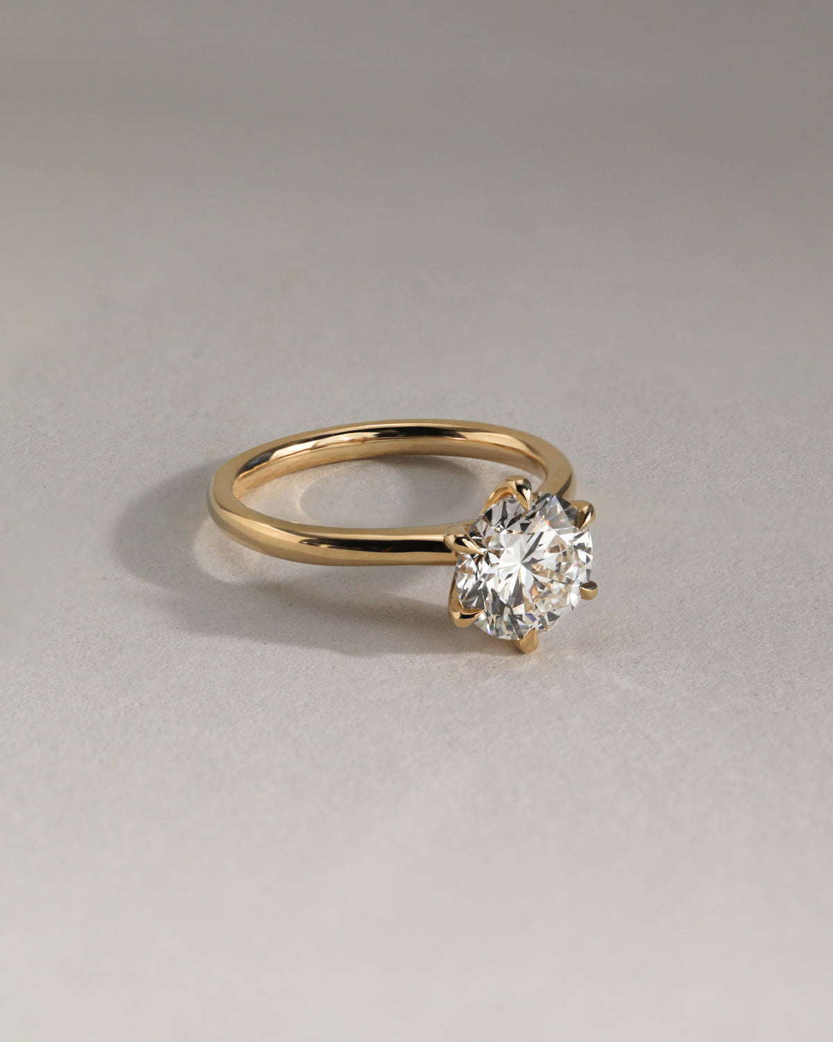 Daniela - Round Claw Solitaire with Solid Cathedral High Setting Engagement Ring - Yellow Gold