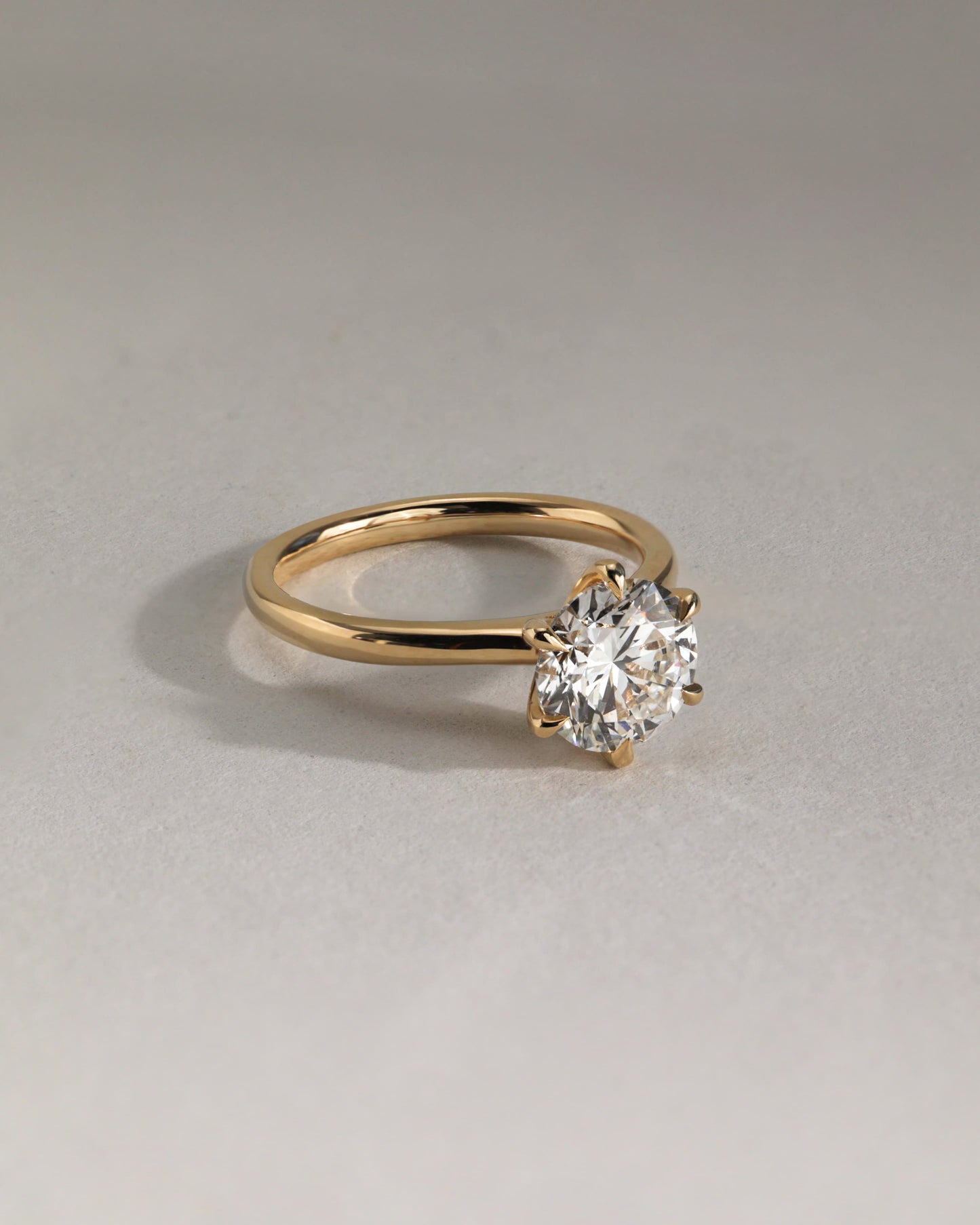 Daniela - Round Claw Solitaire with Solid Cathedral High Setting Engagement Ring - Rose Two-Tone