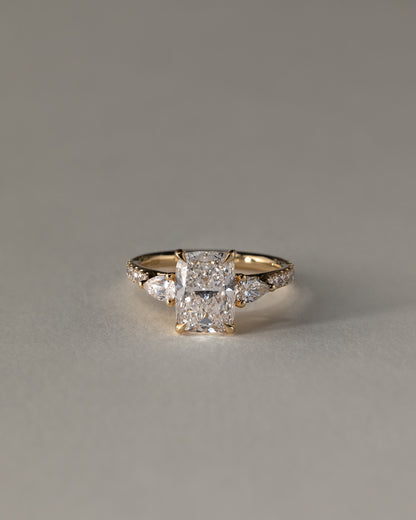 Bree - Elongated Cushion Claw Trilogy with Pear Side Stones and Pave Band Engagement Ring - Platinum