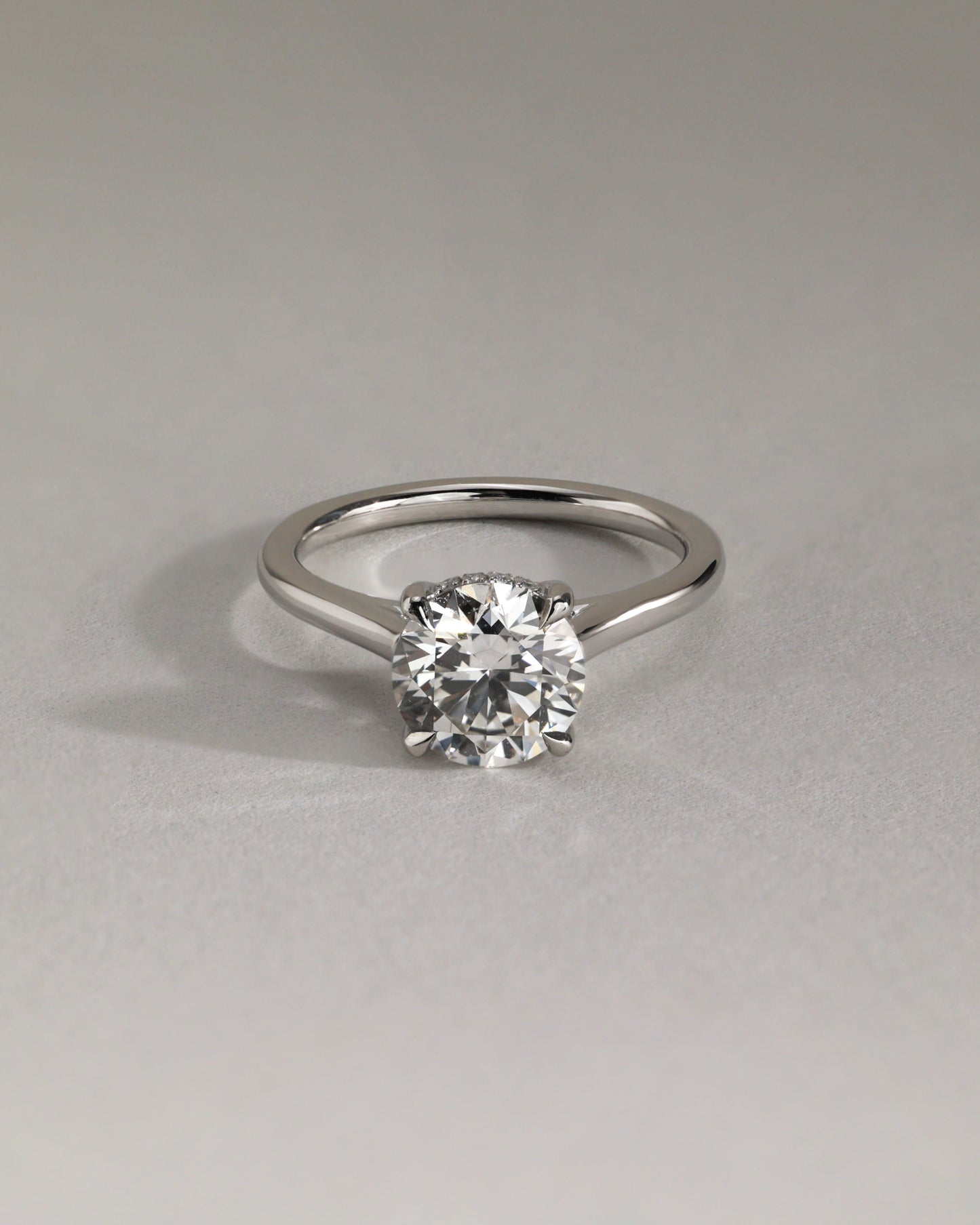 Bonnie - Round Claw Solitaire with Hidden Halo and Cathedral High Setting Engagement Ring - Rose Two-Tone - Lifestyle