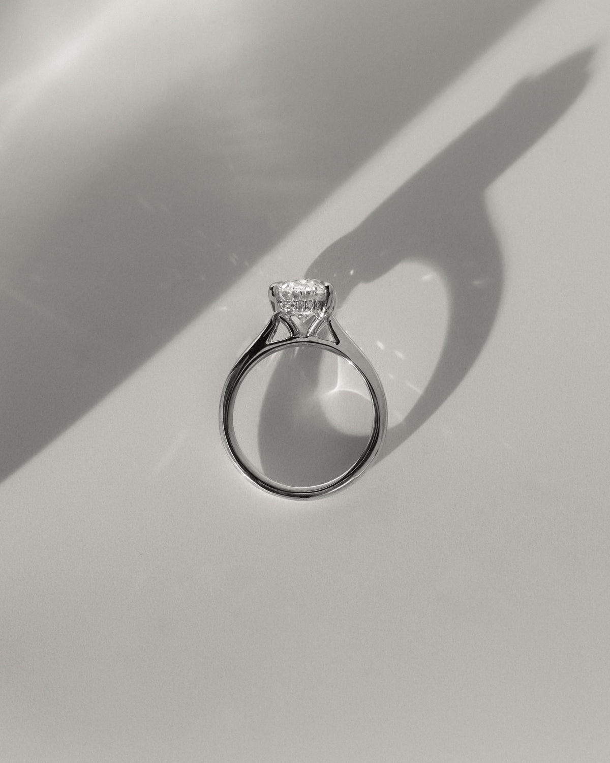 Bethany - Oval Claw Solitaire with Hidden Halo, Tapered Band and Cathedral High Setting Engagement Ring - Yellow Gold