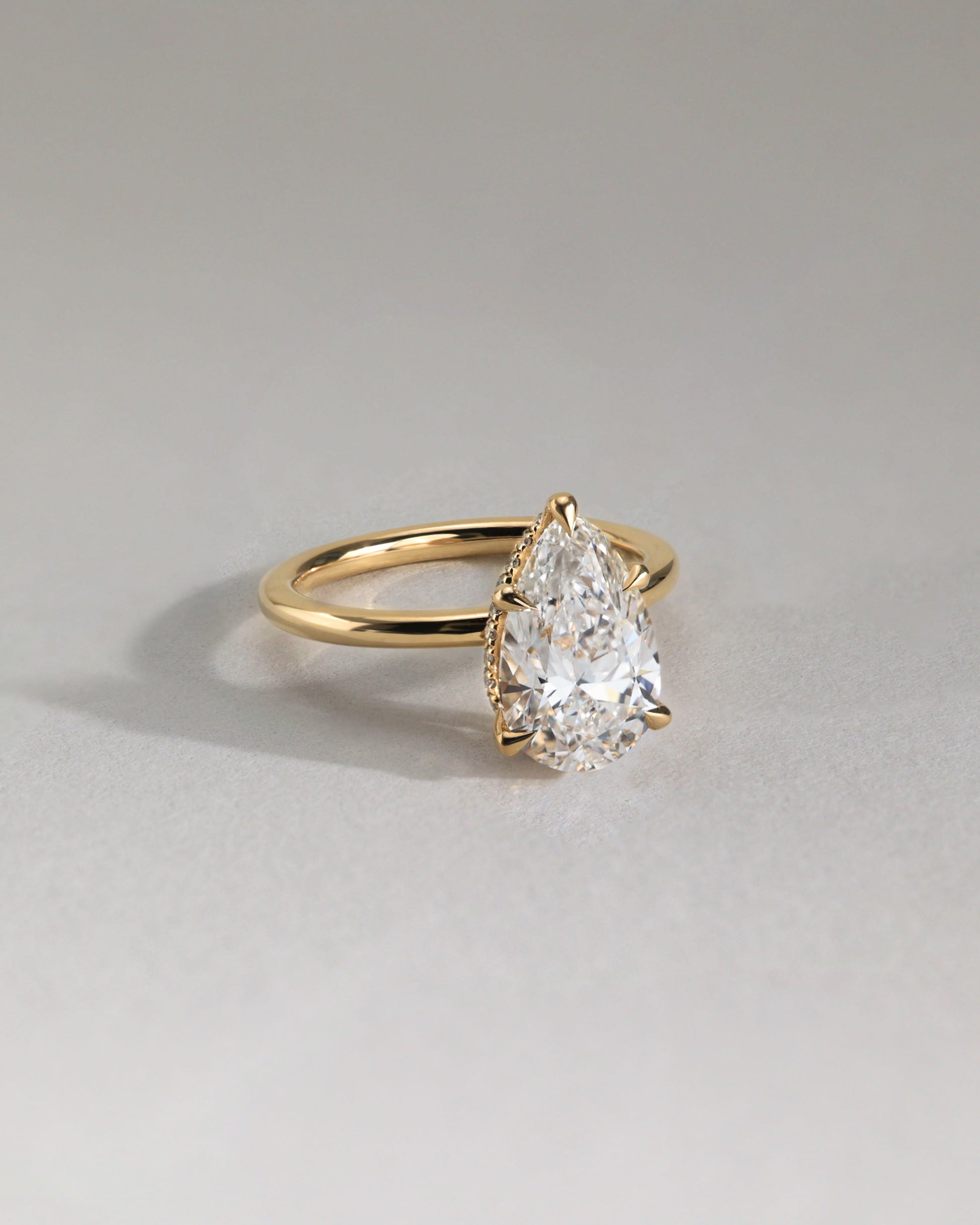 Ainsley - Pear Claw Solitaire with Wrap Around Hidden Halo Engagement Ring - Rose Two-Tone - Lifestyle