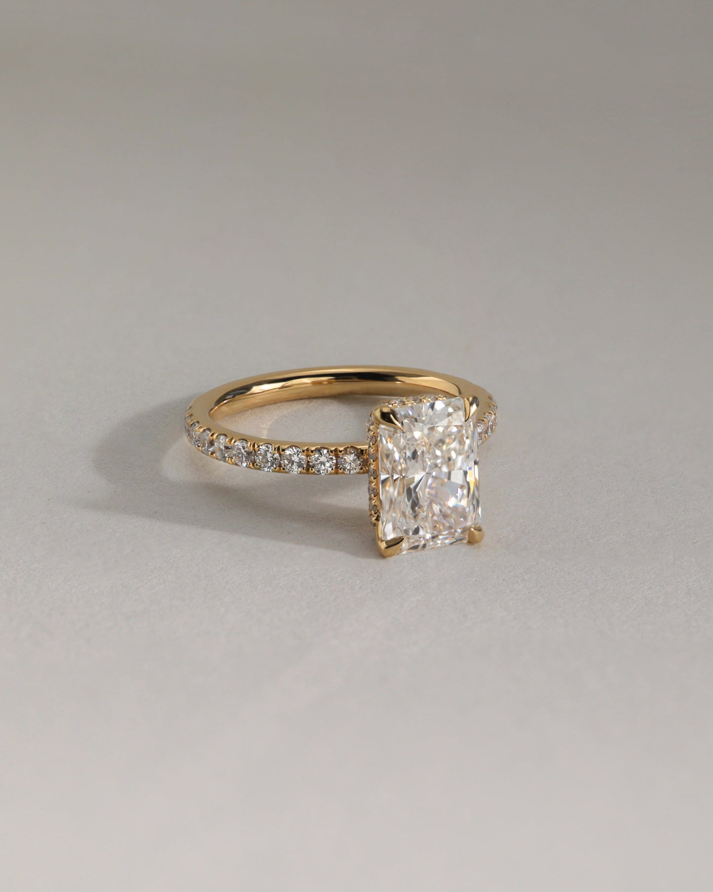 Ellie - Radiant Claw Solitaire with Wrap Around Hidden Halo and Pave Band Engagement Ring - Rose Two-Tone - Lifestyle