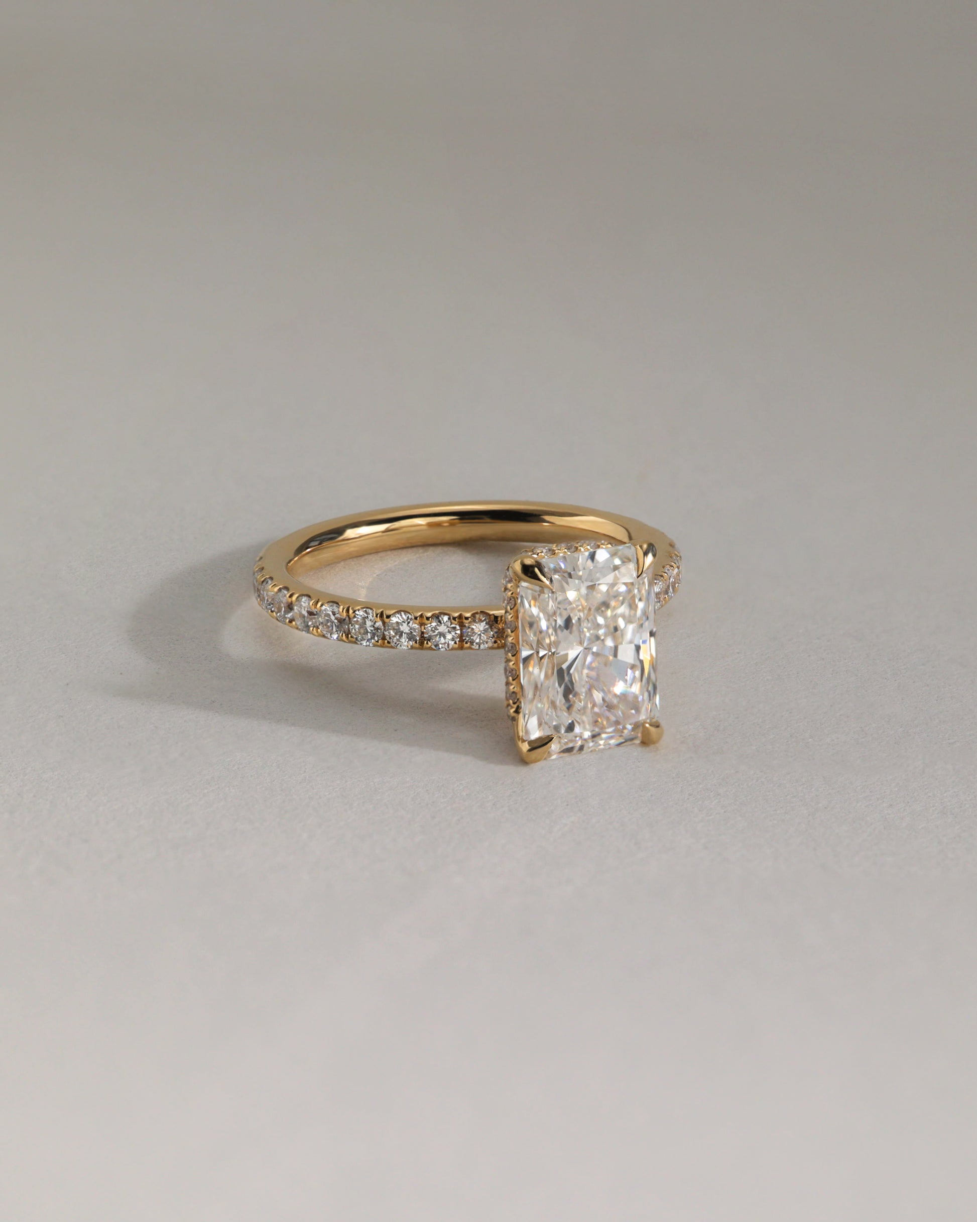 Ellie - Radiant Claw Solitaire with Wrap Around Hidden Halo and Pave Band Engagement Ring - Rose Two-Tone - Lifestyle