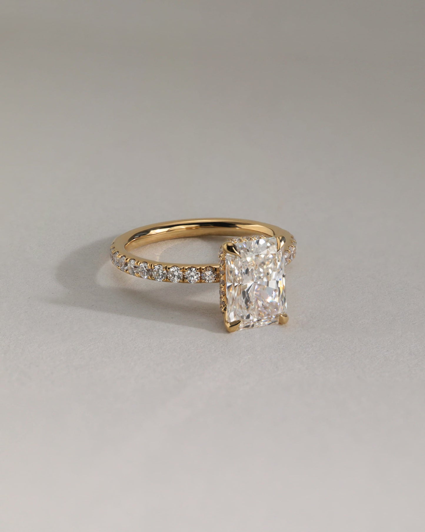 Ellie - Radiant Claw Solitaire with Wrap Around Hidden Halo and Pave Band Engagement Ring - Yellow Two-Tone