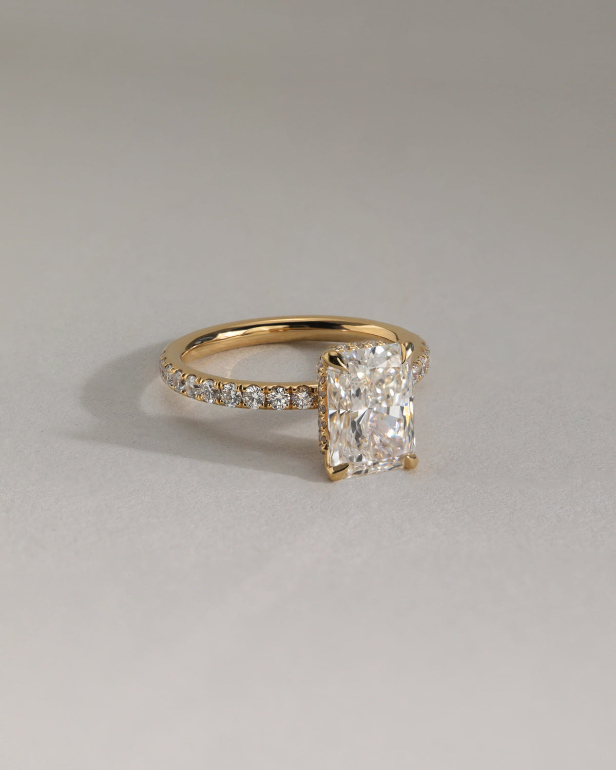 Ellie - Radiant Claw Solitaire with Wrap Around Hidden Halo and Pave Band Engagement Ring - Rose Gold