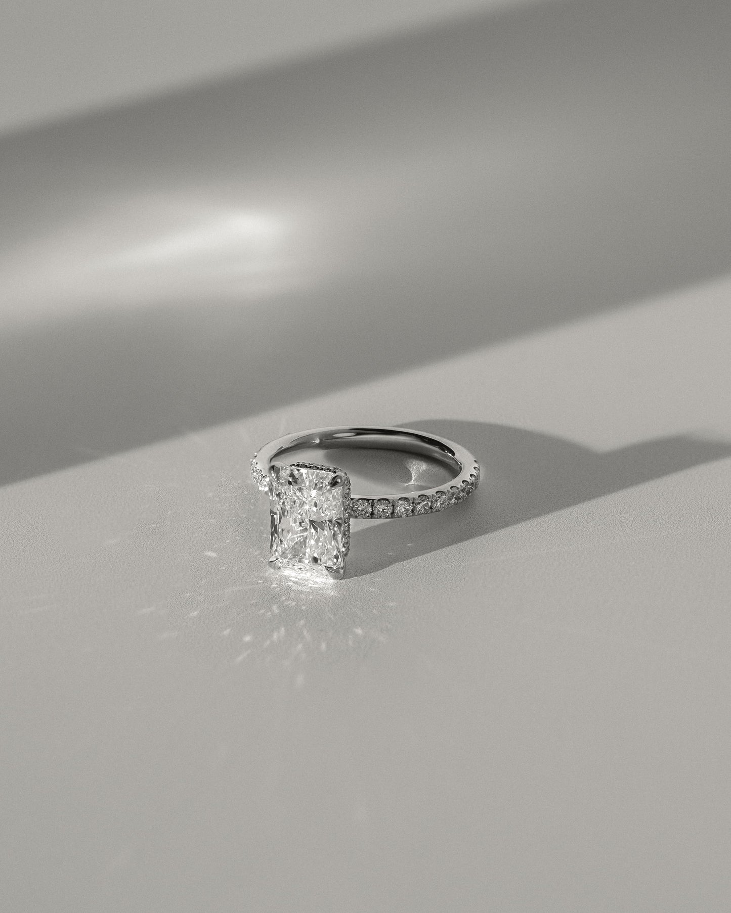 Ellie - Radiant Claw Solitaire with Wrap Around Hidden Halo and Pave Band Engagement Ring - Yellow Gold
