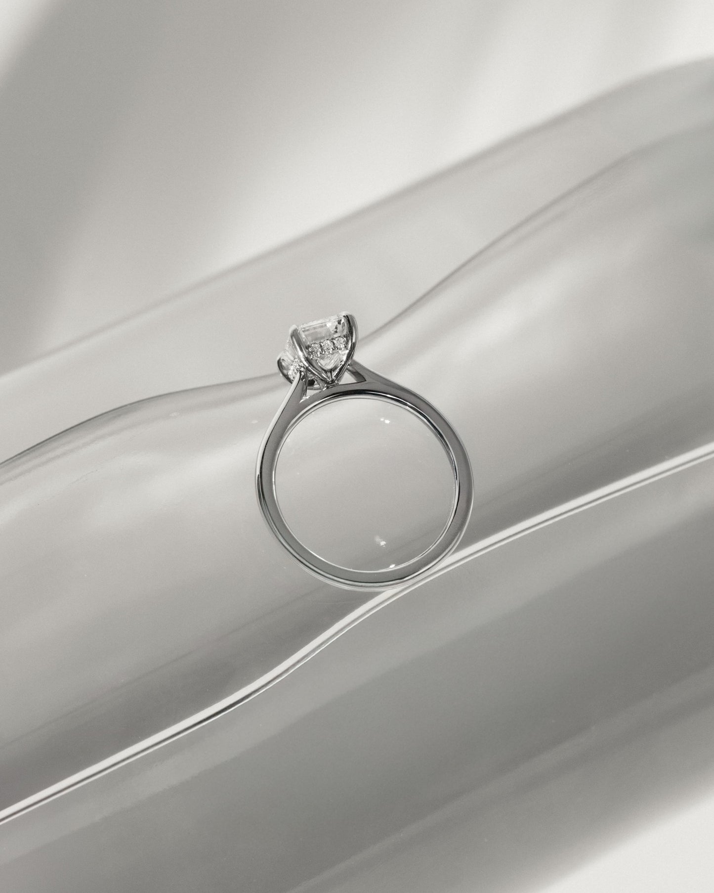 Jane - Emerald Claw Solitaire with Hidden Halo and Cathedral High Setting Engagement Ring - Platinum