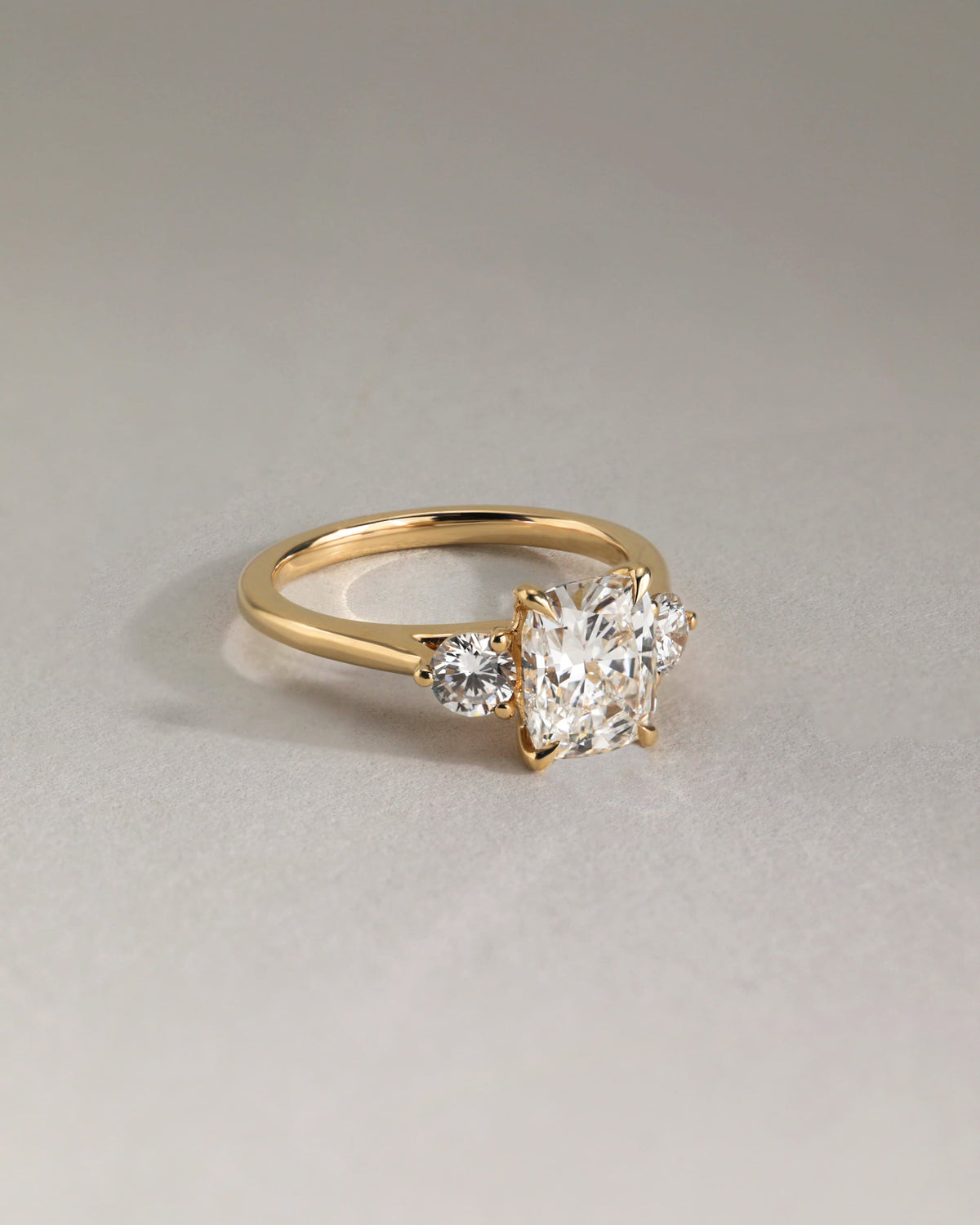 Charmaine - Elongated Cushion Claw Trilogy with Round Side Stones and Lily Detail Engagement Ring - Rose Two-Tone