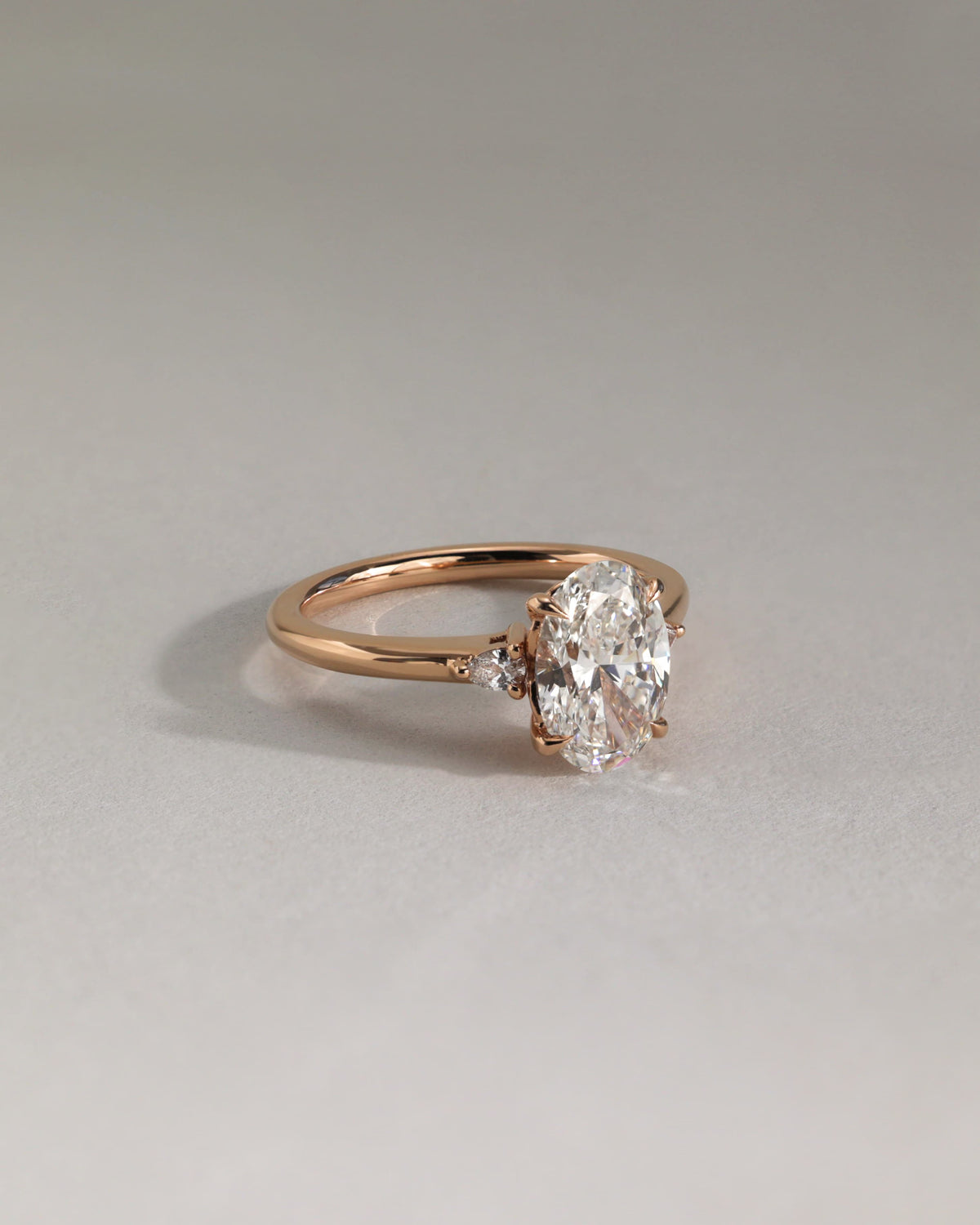 Elena - Oval Claw Trilogy with Pear Side Stones and Tulip Detail Engagement Ring - Yellow Gold