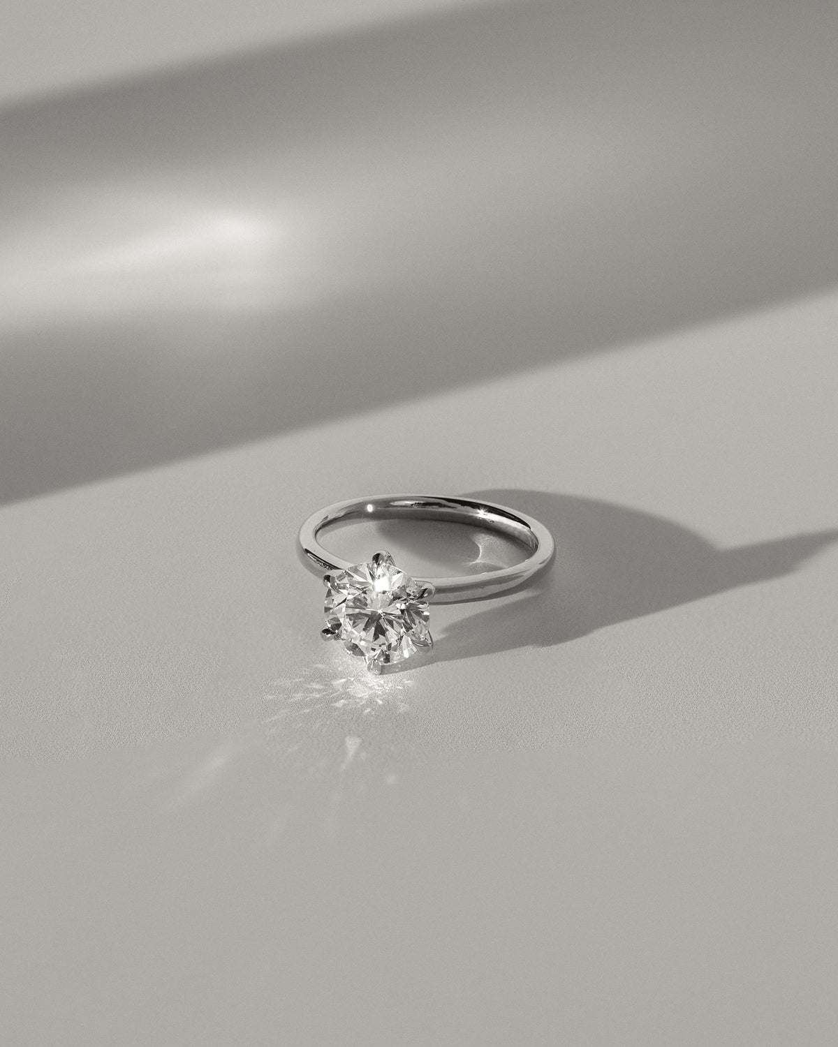 Daniela - Round Claw Solitaire with Solid Cathedral High Setting Engagement Ring - Yellow Gold
