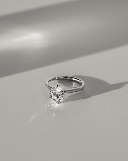 Daniela - Round Claw Solitaire with Solid Cathedral High Setting Engagement Ring - Yellow Gold