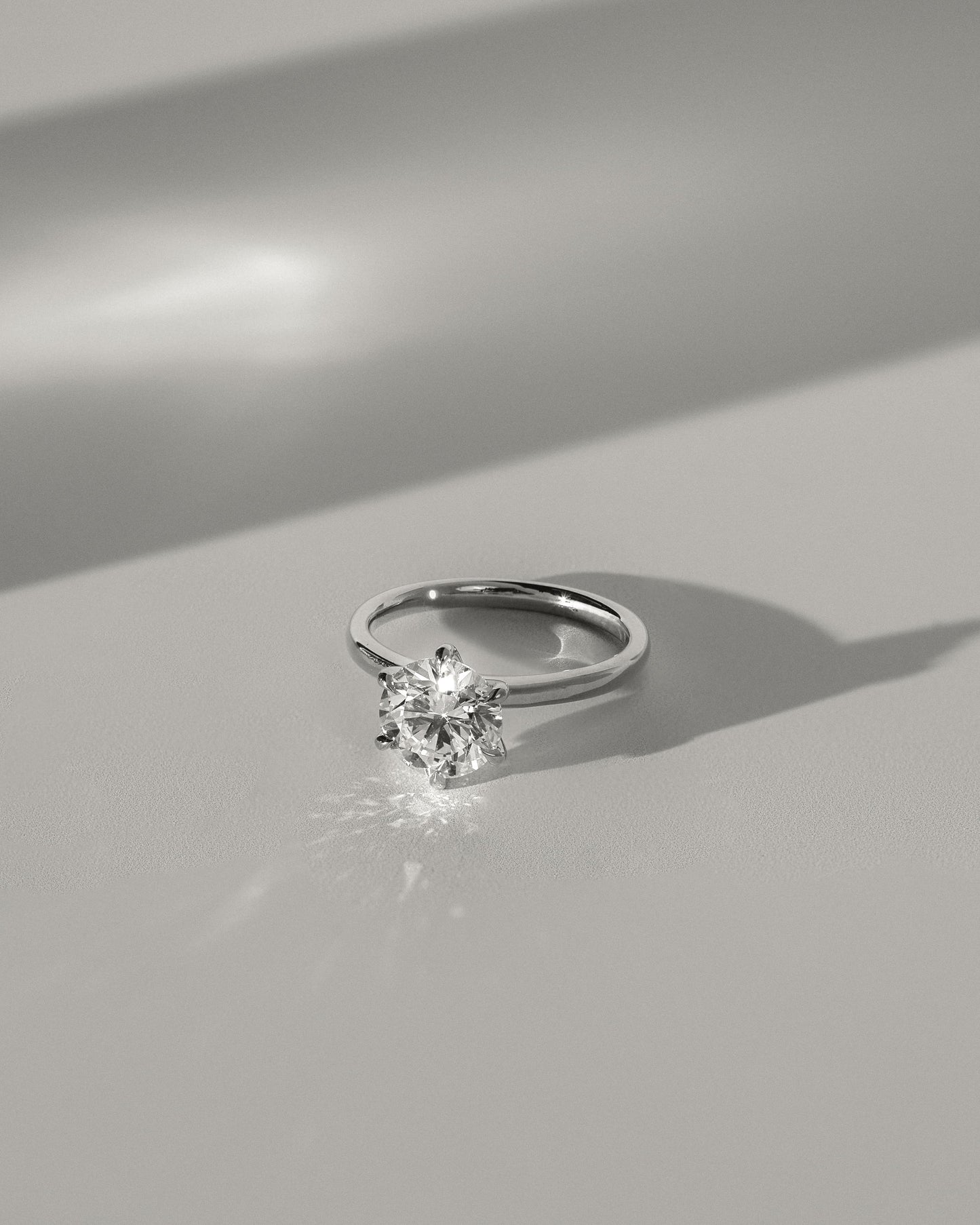 Daniela - Round Claw Solitaire with Solid Cathedral High Setting Engagement Ring - Yellow Two-Tone