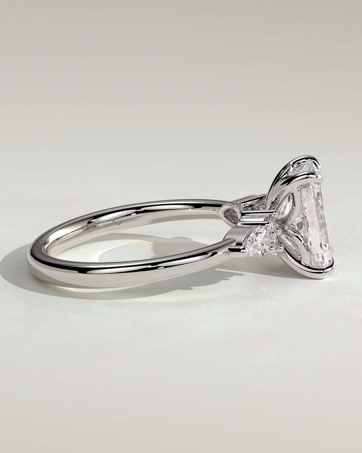 Heidi - Radiant Claw Solitaire with Pear Accents and Round Shoulder Stones Engagement Ring - White Gold
