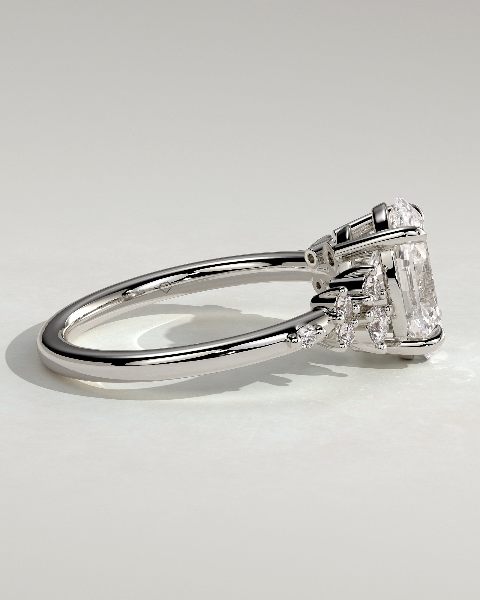 Bella - Oval Claw Solitaire with Clustered Round Shoulder Stones Engagement Ring - Platinum - White Gold / Platinum 2ct