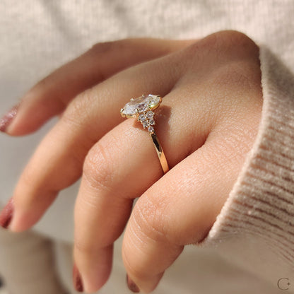 Oval Diamond Ring With Round Cut Side Stone