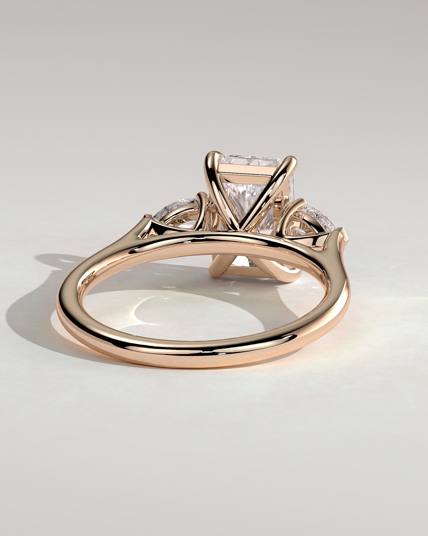 Jasmine - Radiant Claw Trilogy with Pear Side Stones and Cathedral Setting Engagement Ring - Rose Gold