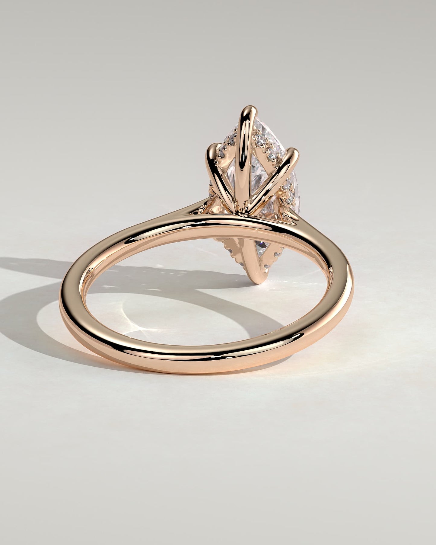Jenna - Marquise Claw Solitaire with Hidden Halo and Cathedral High Setting Engagement Ring - Rose Gold