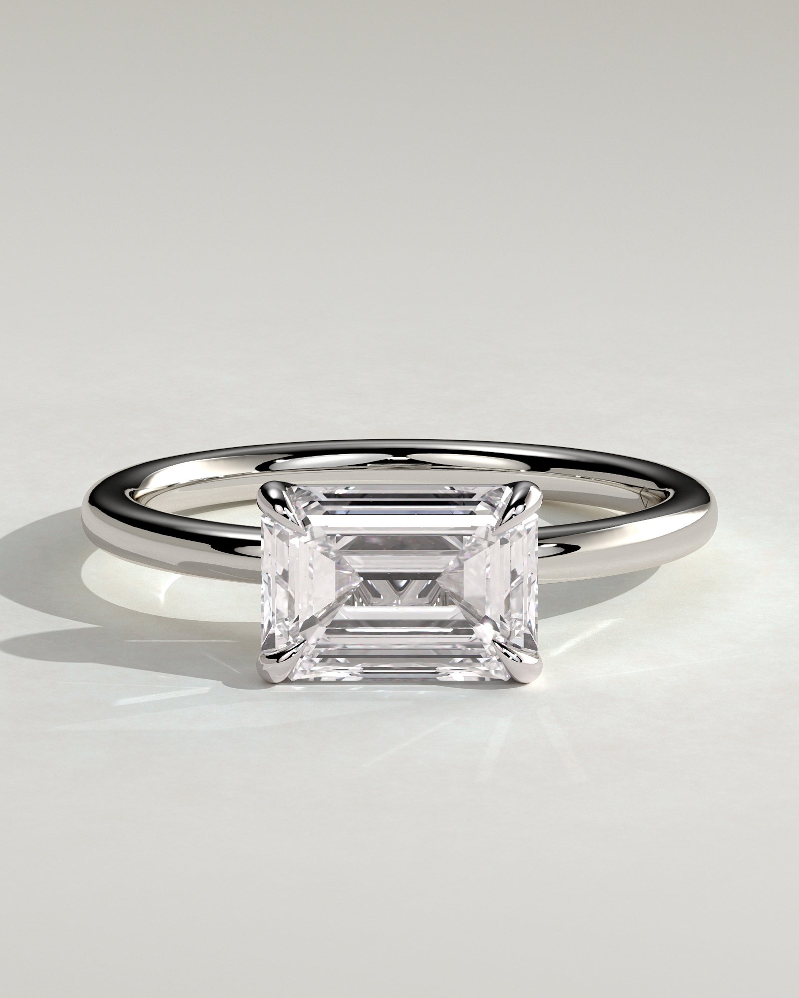 Debbie - Emerald East West Claw Solitaire Engagement Ring - Platinum - White Gold / Platinum 2ct