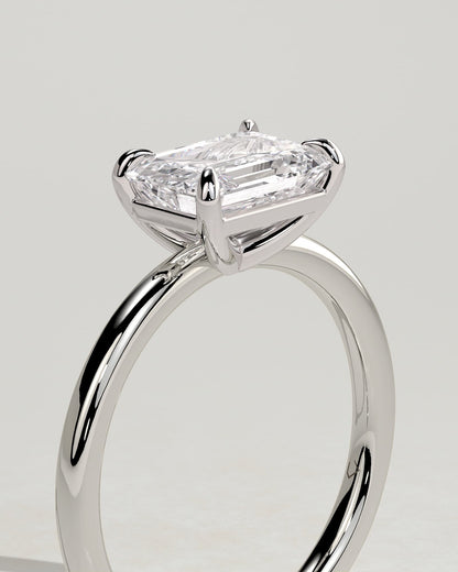 Debbie - Emerald East West Claw Solitaire Engagement Ring - Platinum