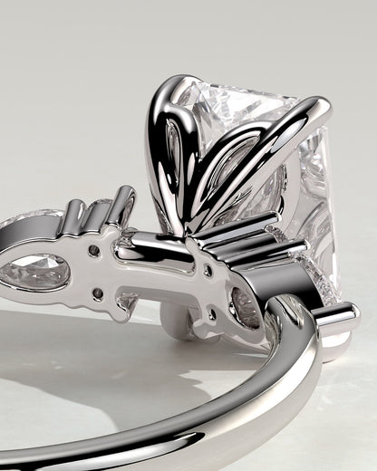 Heidi - Radiant Claw Solitaire with Pear Accents and Round Shoulder Stones Engagement Ring - Platinum